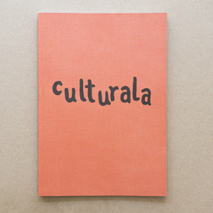 Cover of Culturala #1 in culturala pink with corner open showing text and artwork